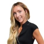 a woman with long blonde hair wearing a black top.