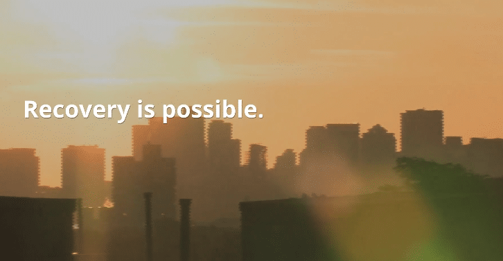 a picture of a city skyline with the words recovery is possible.