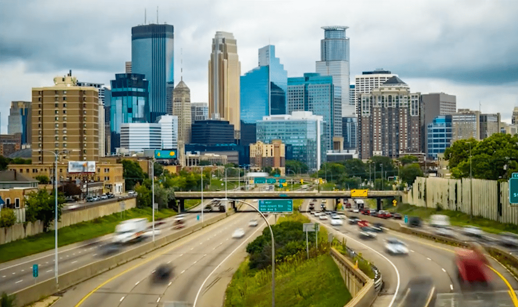 a view of a city skyline from a freeway.