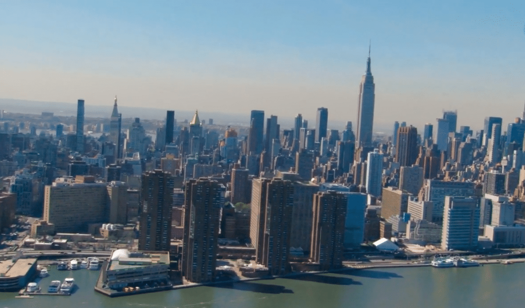 an aerial view of a large city with tall buildings.