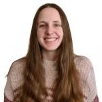 a woman with long brown hair smiling at the camera.