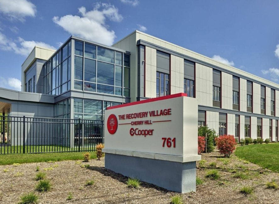 a large building with a sign in front of it.