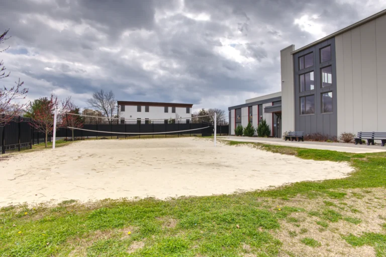 The Recovery Village Cherry Hill at Cooper Drug and Alcohol Rehab near Philadelphia sand volleyball court scaled